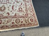 a rug on the ground next to a pair of shoes