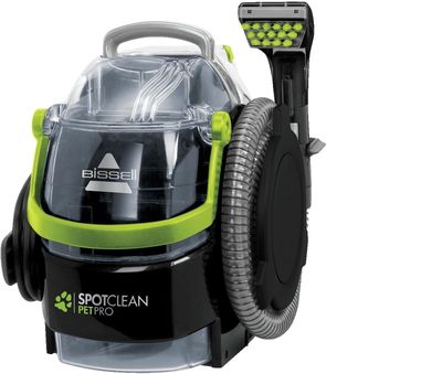 un gros plan d'un aspirateur vert et noir sur fond blanc