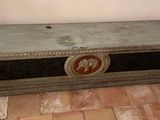 an old trunk sitting on a tiled floor in a room