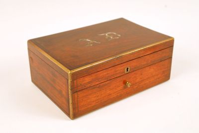 an image of a wooden box with a monogram on it