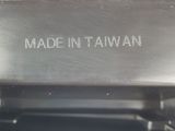 an image of a close up of a metal object with writing on it