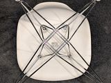 a white plate with a wire design on it