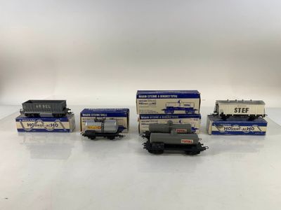 a group of toy trains sitting on top of a white table