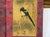 a picture of a bird sitting on a branch of a tree