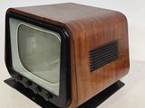 a small wooden television set sitting on a table