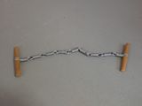a metal object with a wooden handle attached to it