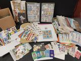a lot of stamps and envelopes on the table