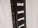 a picture of a wall mounted shelf that is being wrapped in plastic