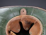 a green hat with a leather band and a brown hat with a leather band and a brown hat with a leather band and a brown hat with a brown