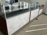 a glass display case in the middle of a room