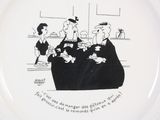 a plate with a cartoon of a family sitting on a couch