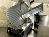 an image of a kitchen counter with a meat slicer on it