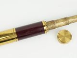 an old brass telescope with a wooden case and brass fittings