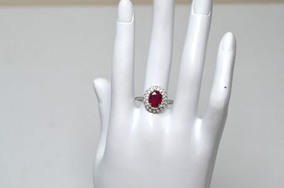 an image of a woman ' s hand with a ring on it