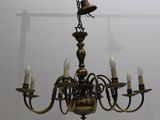 a chandelier hanging from the ceiling in the room