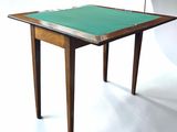 a small table with a green cloth on top of it