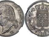 a close up of a coin with a crown on top of it