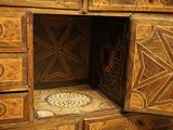 an image of a wooden cabinet with a decorative design