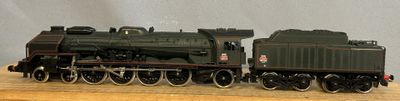 a toy train that is sitting on a wooden table