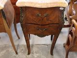 a table with a marble top and chairs in a room