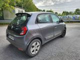 a small car that is parked in the parking lot