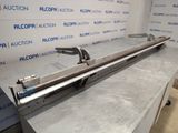 a close up of a metal object on a table in front of a wall