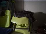 a yellow chair and a green chair in a room