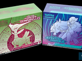 two boxes of pokemon trading cards on a black background