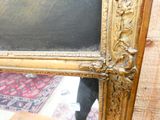 a picture of a mirror with a picture of a person in it