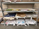 a lot of papers that are stacked on a shelf