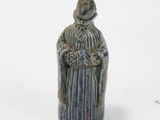 a figurine of a woman holding a flower in her hands