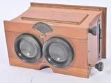 a wooden box with two speakers on top of it
