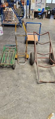 many different types of hand trucks in a warehouse