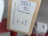 a red candle with a price tag on it