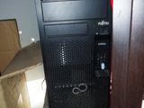 a black computer tower sitting on top of a box