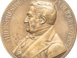 l'image d'une pièce d'or sur laquelle figure le portrait d'un homme