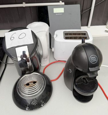 a coffee maker, toaster, toaster, toaster and toaster on a counter