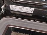 a close up of an open oven with the door open