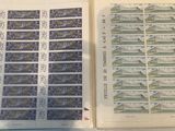 two pages of stamps on top of each other on a table