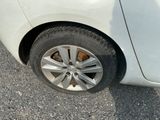 a white car that has a flat tire on it