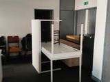 a room with a desk and a chair in it