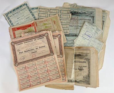 several old paper certificates are stacked on top of each other