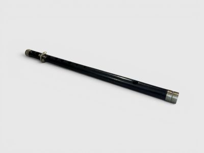 a close up of a pen on a white surface with a white background