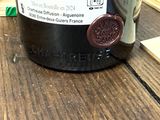 a bottle of wine that is sitting on a table