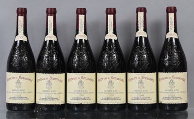 six bottles of wine are lined up in a row on a table