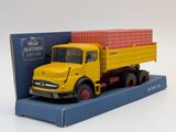 a toy truck with a box on the back of it