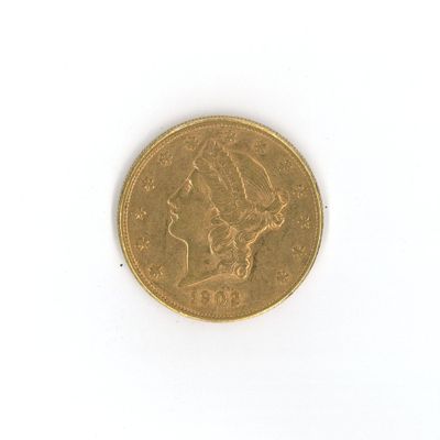 a gold coin with a picture of a woman on it