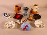 many different bowls and cups on the table