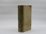 an old book that is sitting on a table