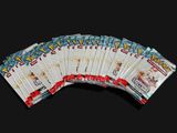 several packs of pokemon cards are stacked on top of each other